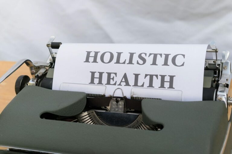 A typewriter with the word holistic health on it